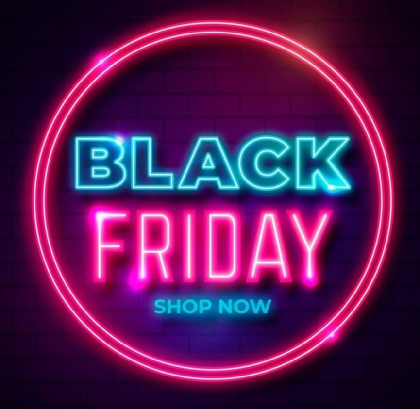 Neon sign with 'Black Friday Shop Now' text on a dark background